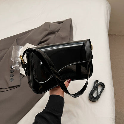 Tira | Sac bandoulière brillant au design ondulé