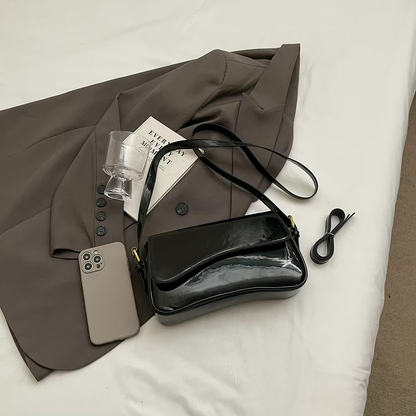 Tira | Sac bandoulière brillant au design ondulé