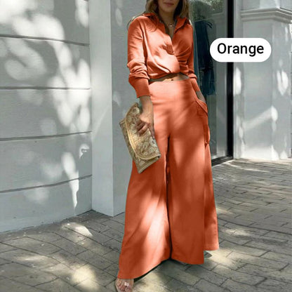 Elegante tweedelige set: top met lange mouwen en boord en broek met hoge taille